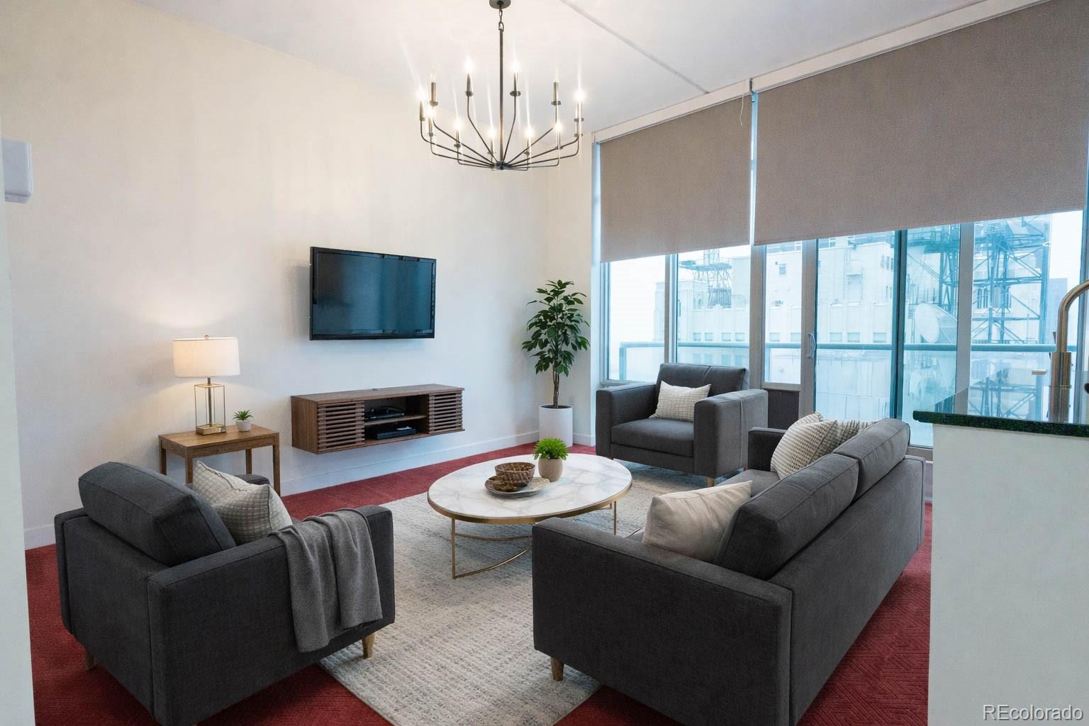 a living room with fireplace furniture and a flat screen tv