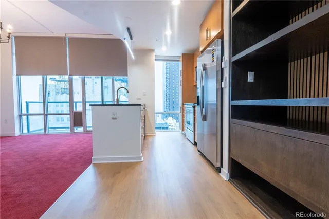 a view of hallway with wooden floor and stairs
