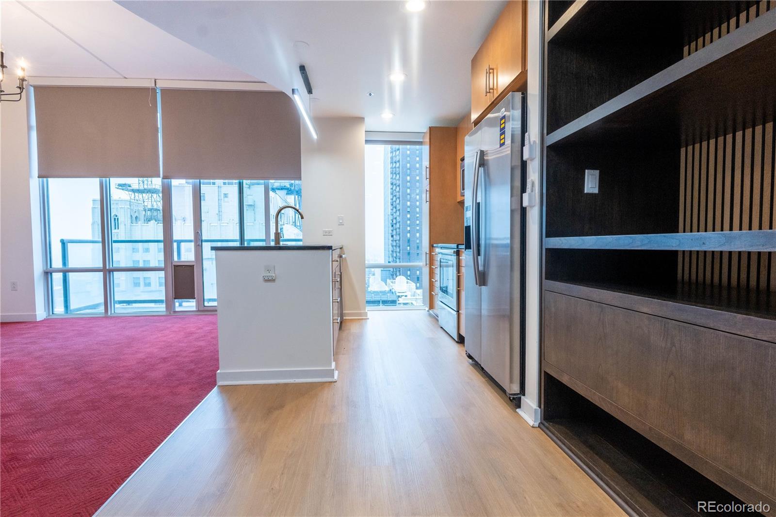 891 14th Street, Unit 2105 Denver, CO 80202 - Photo 12 of 50 a view of hallway with wooden floor and stairs