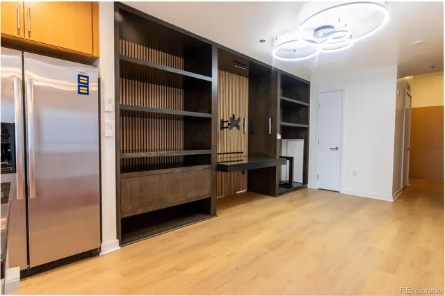 a view of an empty room with closet