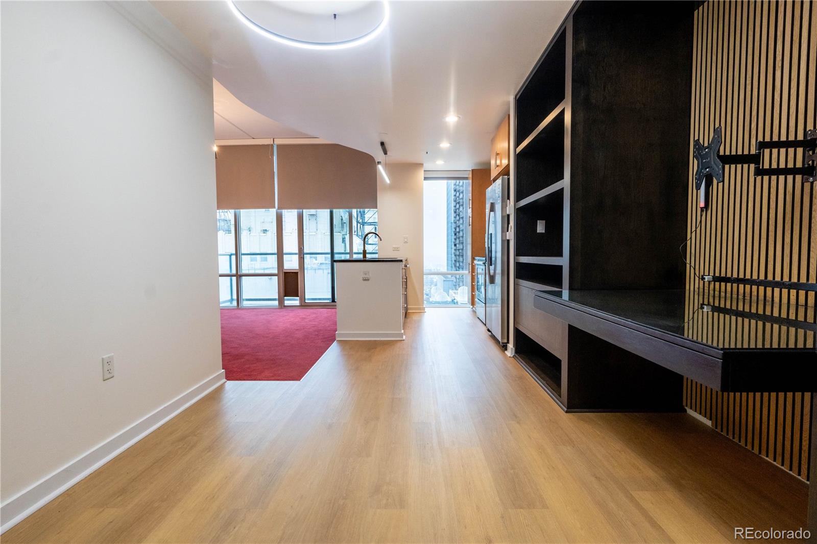 891 14th Street, Unit 2105 Denver, CO 80202 - Photo 18 of 50 an empty room with wooden floor and windows