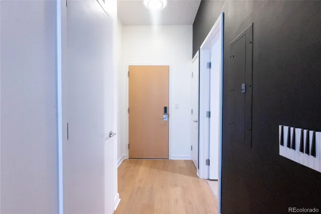 a bedroom with bed and night stand