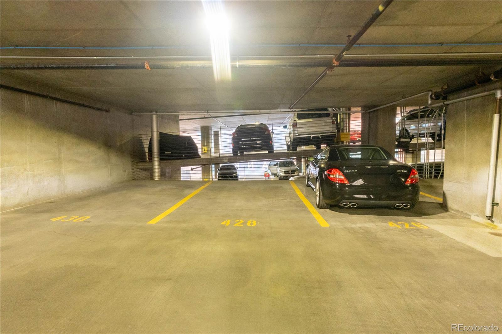 891 14th Street, Unit 2105 Denver, CO 80202 - Photo 30 of 50 a view of parking garage with cars