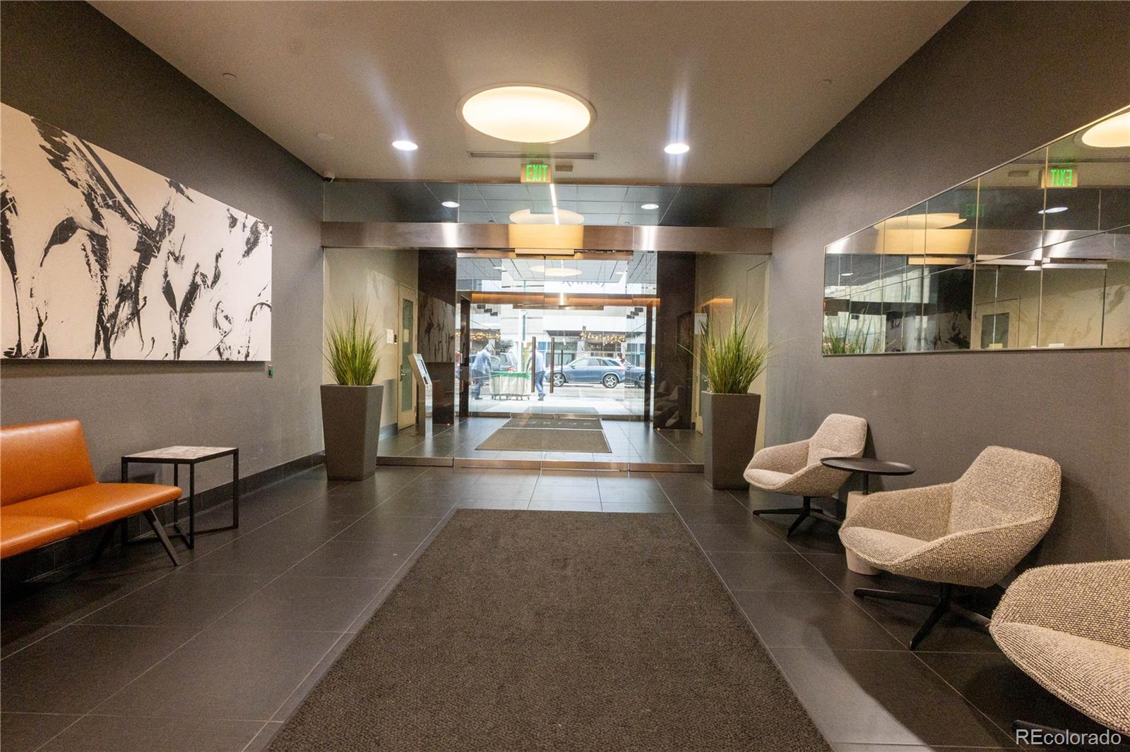 891 14th Street, Unit 2105 Denver, CO 80202 - Photo 32 of 50 a lobby with furniture and large windows