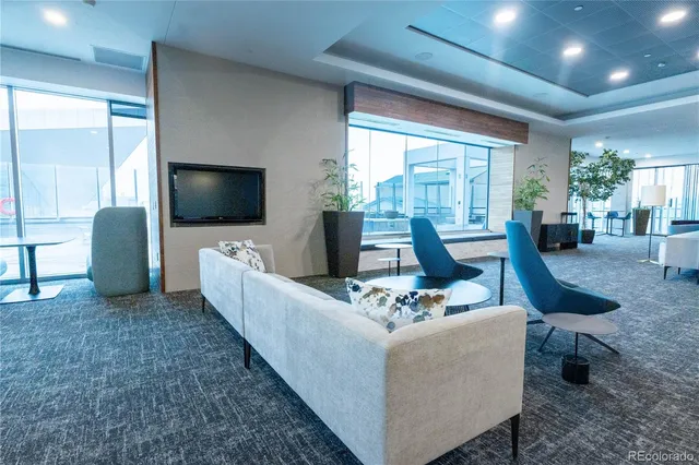 a swimming pool with outdoor seating and yard