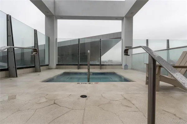 a view of staircase with white walls and a window