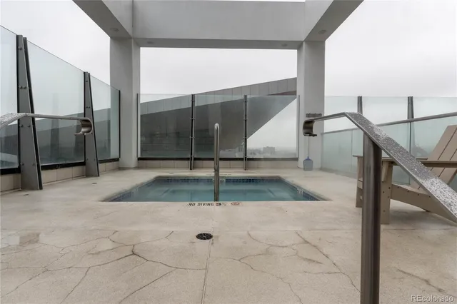 a view of staircase with white walls and a window