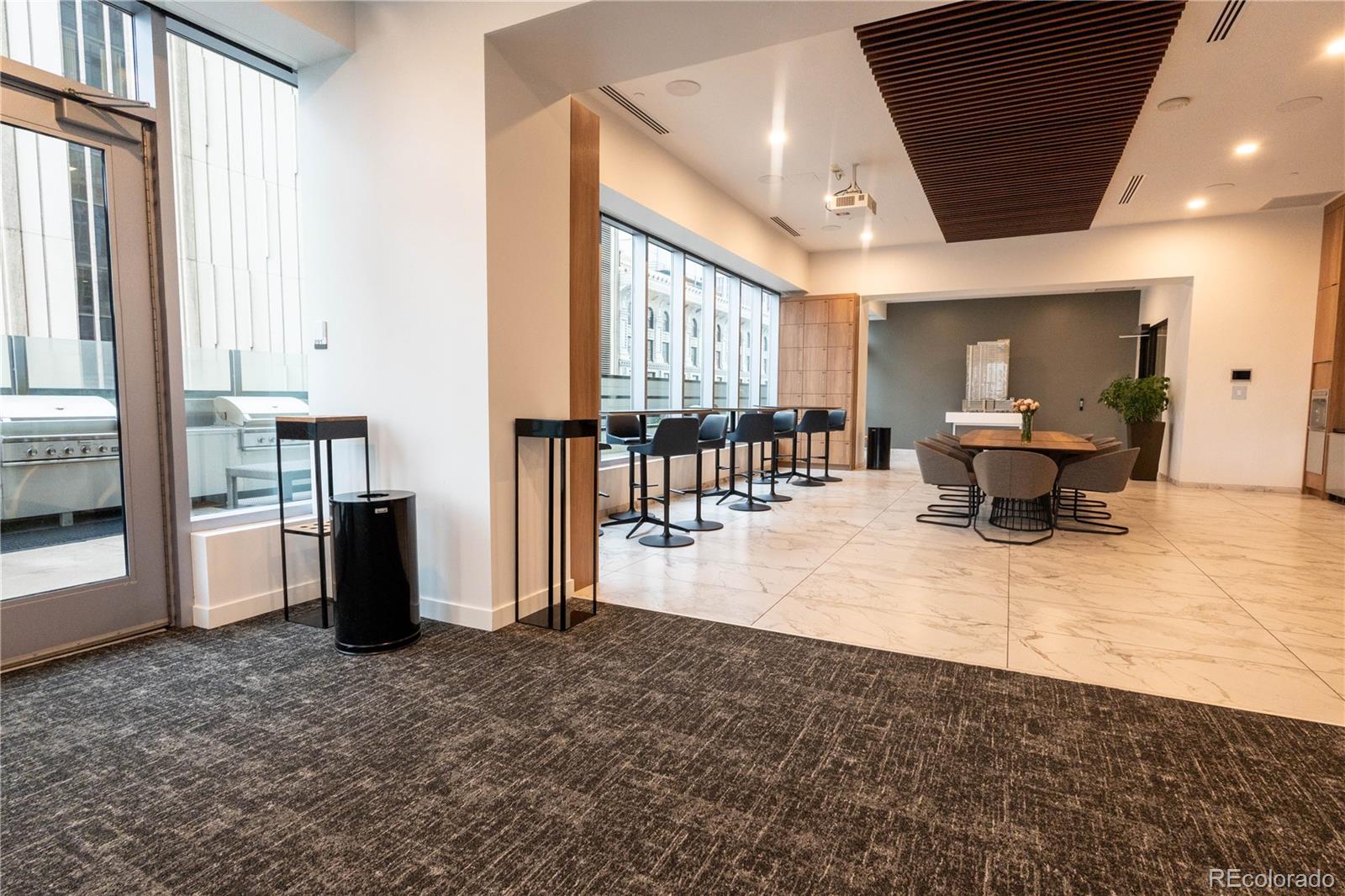 891 14th Street, Unit 2105 Denver, CO 80202 - Photo 43 of 50 a lobby with furniture and large windows