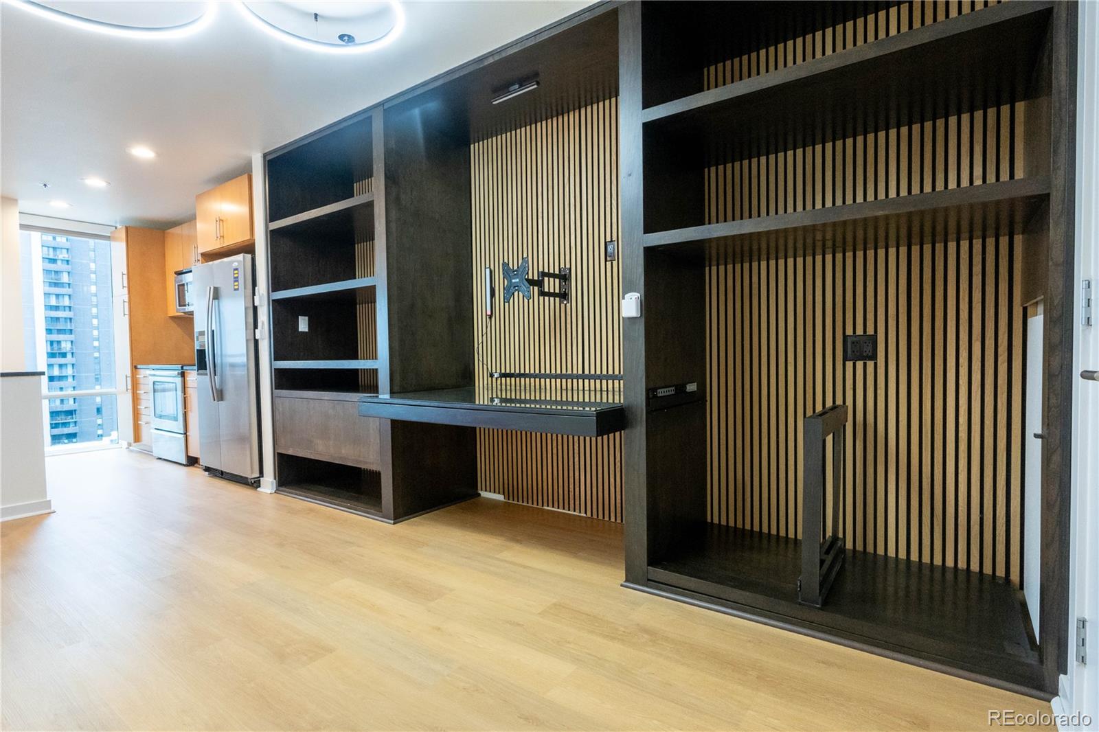 891 14th Street, Unit 2105 Denver, CO 80202 - Photo 6 of 50 an empty room with wooden floor and windows