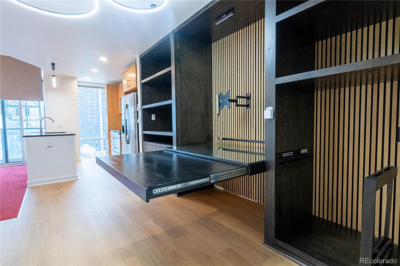 891 14th Street, Unit 2105 Denver, CO 80202 - Photo 10 of 50 a view of a living room hardwood floor and a kitchen