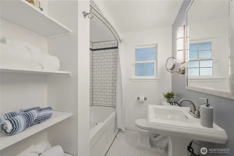 a bathroom with a sink toilet and bathtub