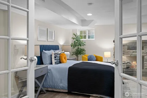 a bedroom with furniture and a window