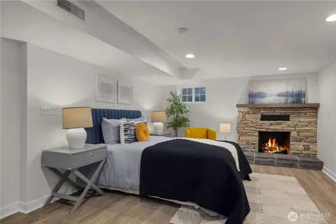 a bed room with a bed and a fireplace