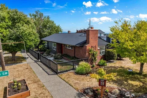 a view of a house with roof deck front of house