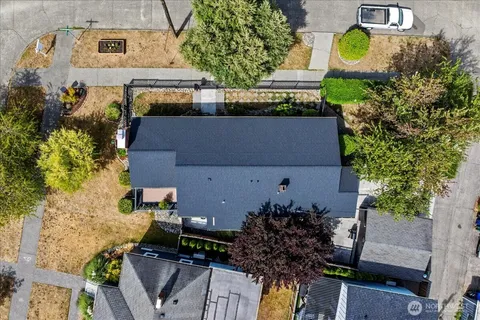 an aerial view of a house with yard