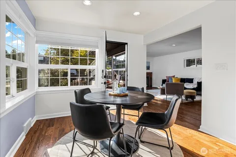 a dining room with furniture and window
