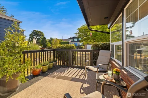 a view of a chairs and table in patio