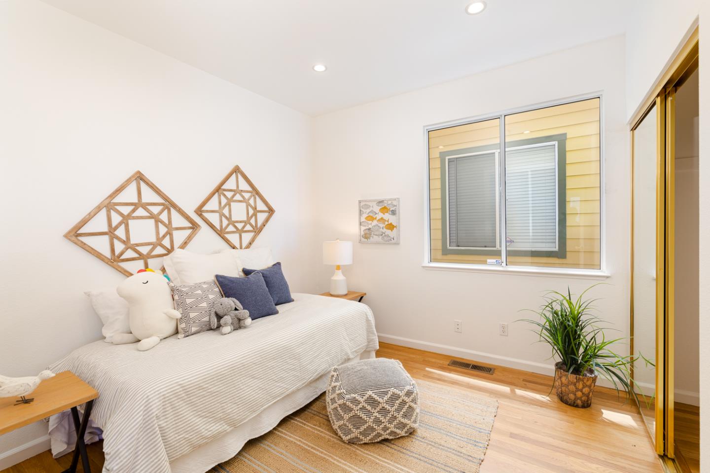 388 Bay Ridge Drive Daly City, CA 94014 - Photo 17 of 32 a bedroom with a bed and wooden floor