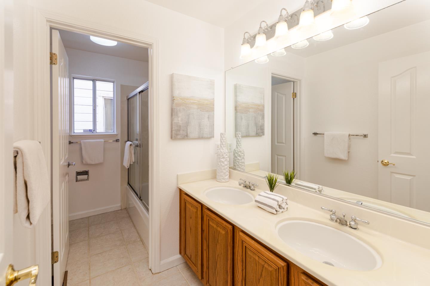 388 Bay Ridge Drive Daly City, CA 94014 - Photo 19 of 32 a bathroom with a double vanity sink mirror and shower