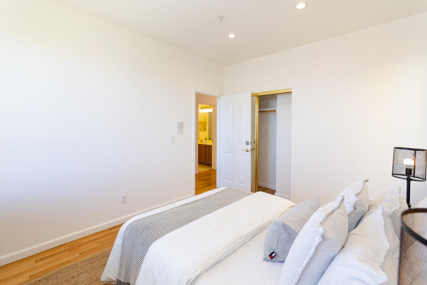 388 Bay Ridge Drive Daly City, CA 94014 - Photo 23 of 32 a bedroom with a bed and a lamp