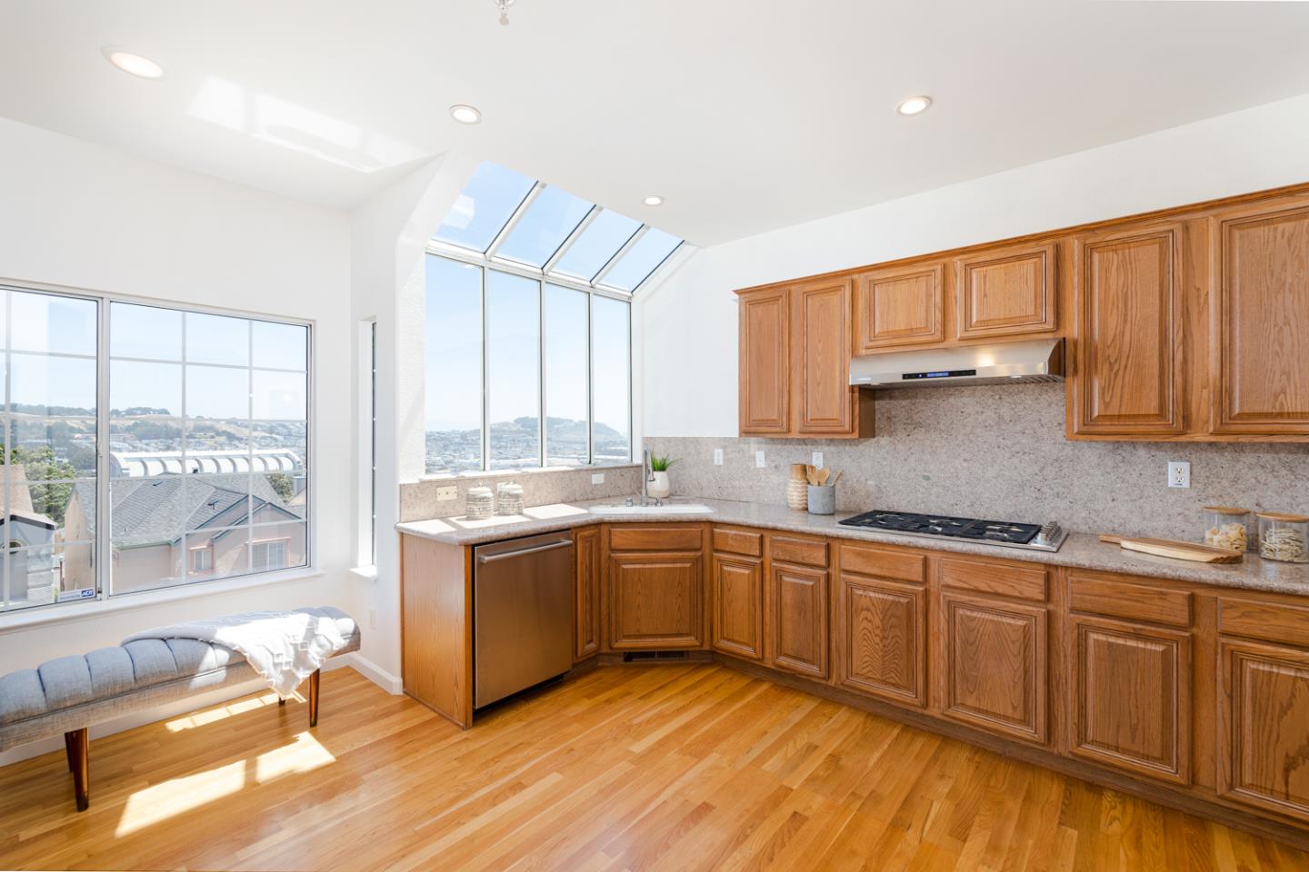 388 Bay Ridge Drive Daly City, CA 94014 - Photo 7 of 32 a kitchen with stainless steel appliances granite countertop a stove and cabinets