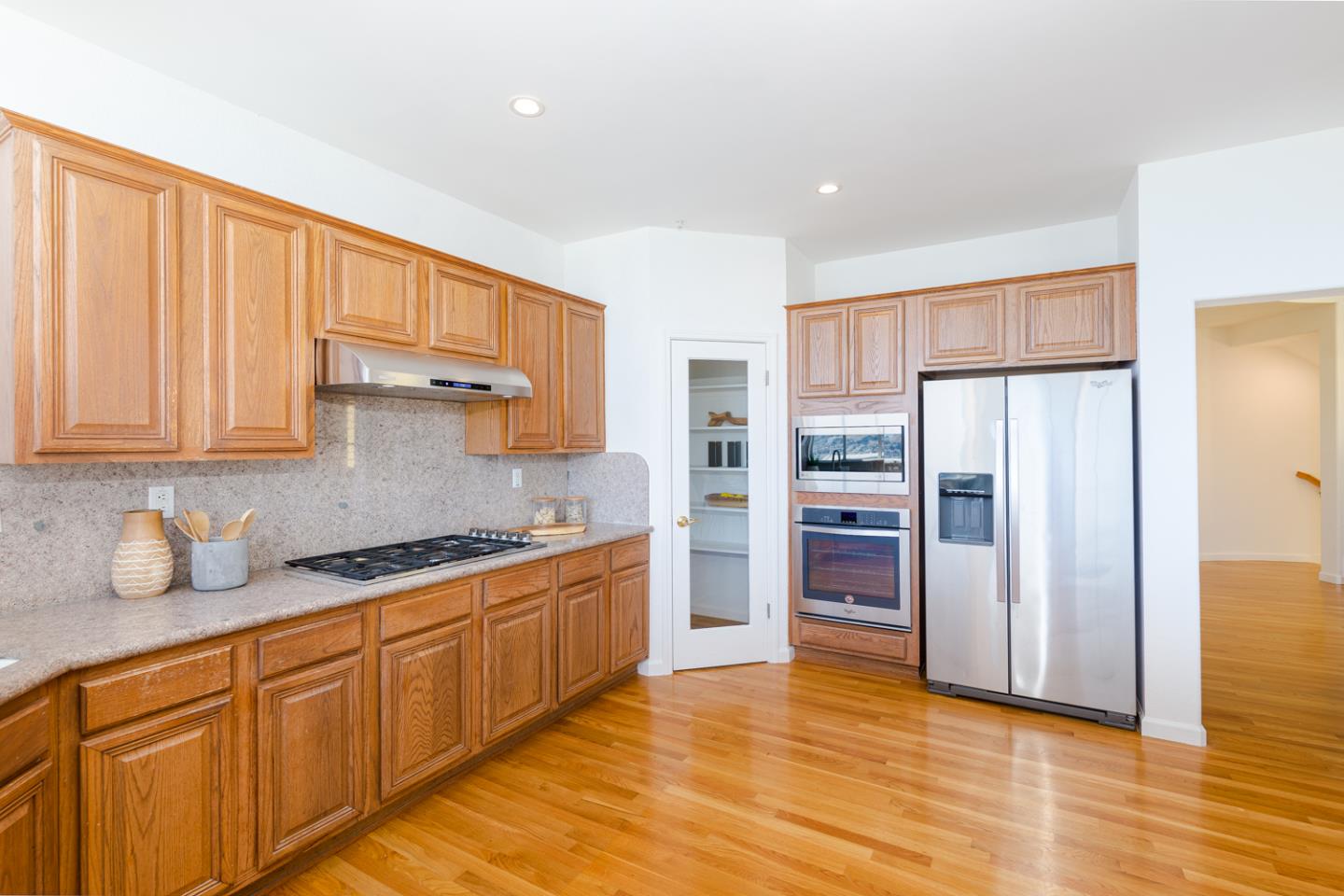 388 Bay Ridge Drive Daly City, CA 94014 - Photo 8 of 32 a kitchen with stainless steel appliances granite countertop a refrigerator and a sink