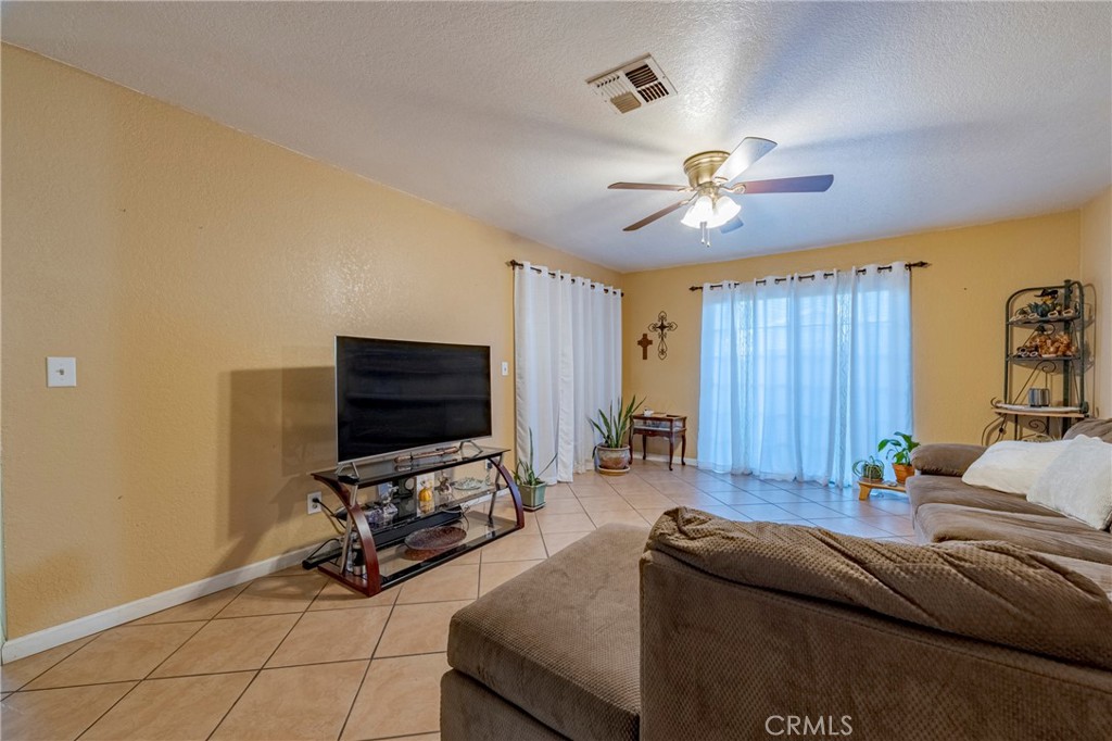2394 Lance Street Merced, CA 95348 - Photo 17 of 34 a living room with furniture and a flat screen tv