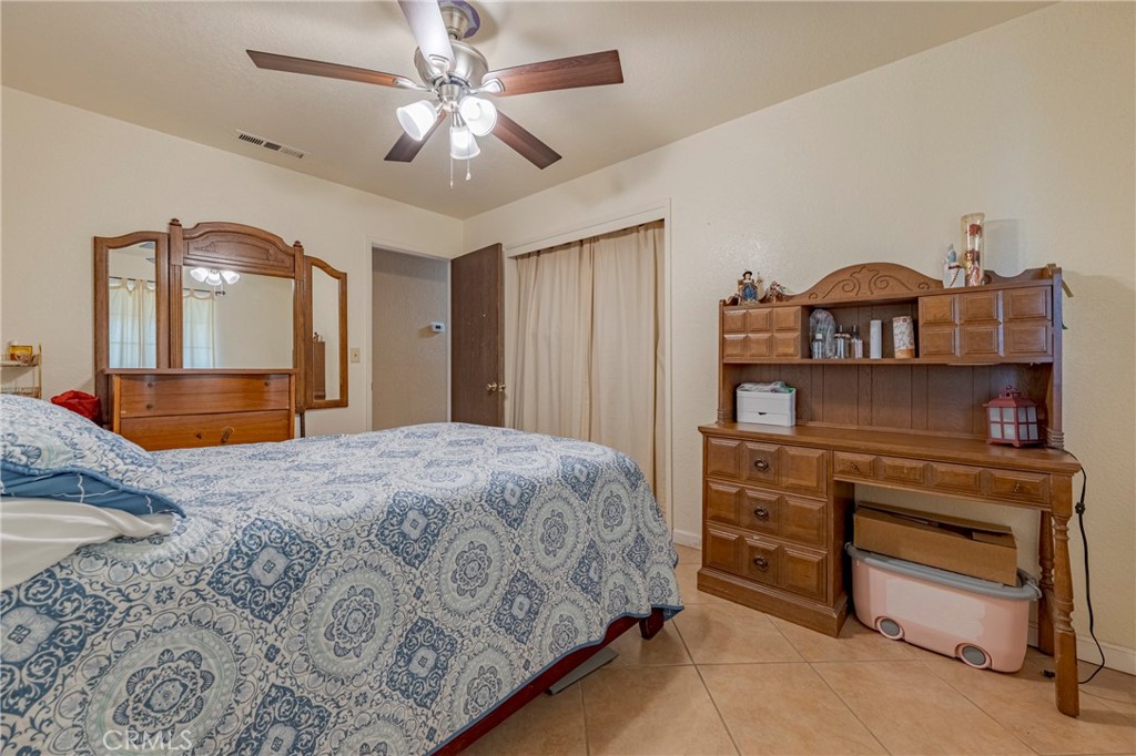 2394 Lance Street Merced, CA 95348 - Photo 19 of 34 a bedroom with a bed and a dresser