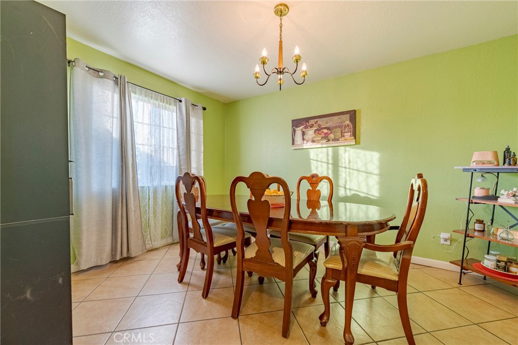 2394 Lance Street Merced, CA 95348 - Photo 7 of 34 a view of a dining room with furniture and chandelier