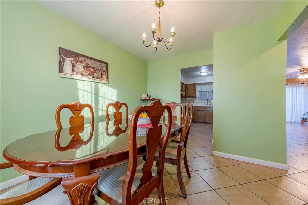2394 Lance Street Merced, CA 95348 - Photo 8 of 34 a dining room with furniture and chandelier