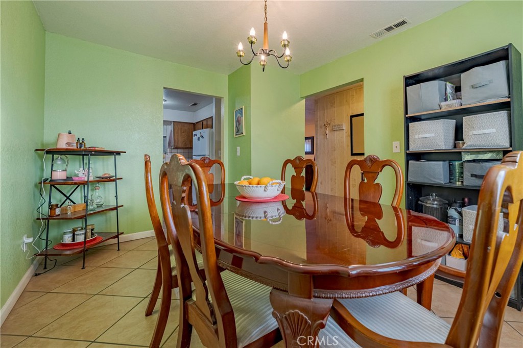 2394 Lance Street Merced, CA 95348 - Photo 9 of 34 a dining room with furniture and window