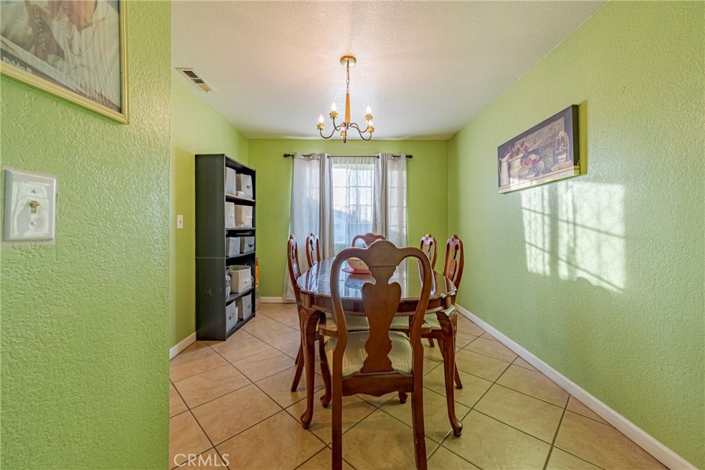 2394 Lance Street Merced, CA 95348 - Photo 10 of 34 a view of a dining room with furniture window and outside view