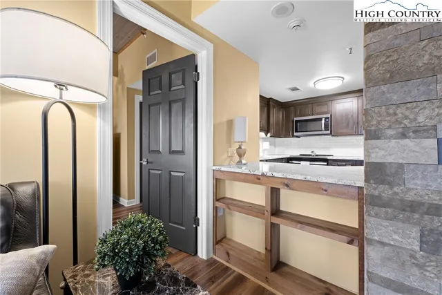 a balcony with chairs and with outdoor views