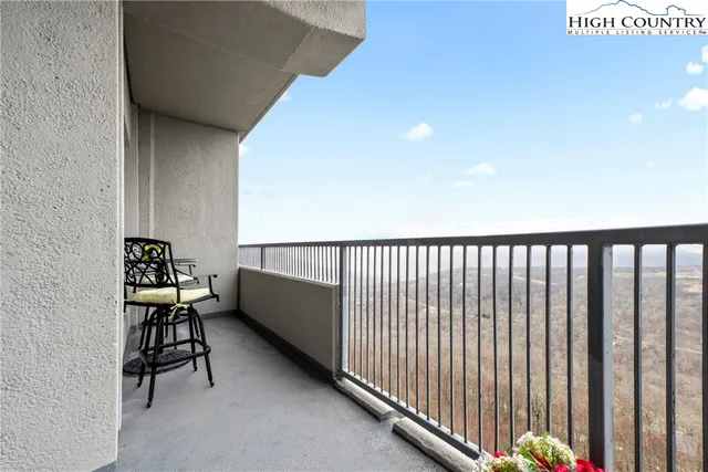 a view of balcony with furniture