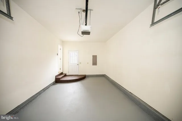 a view of staircase with white walls