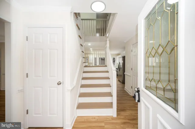 a view of entryway with wooden floor