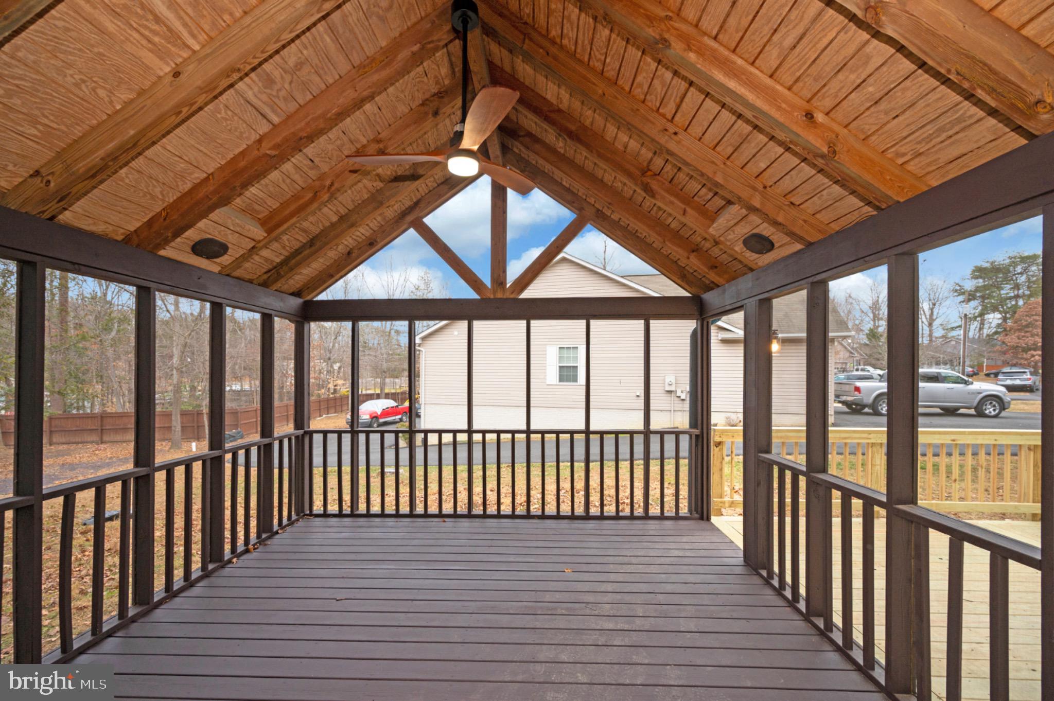 223 Spotswood Road Locust Grove, VA 22508 - Photo 42 of 64 Charming screened porch with rustic appeal.