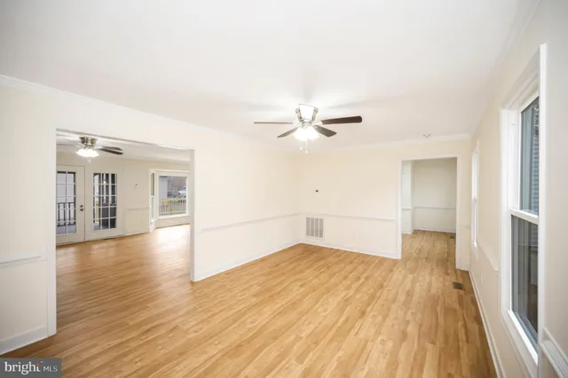 a large kitchen with cabinets and stainless steel appliances