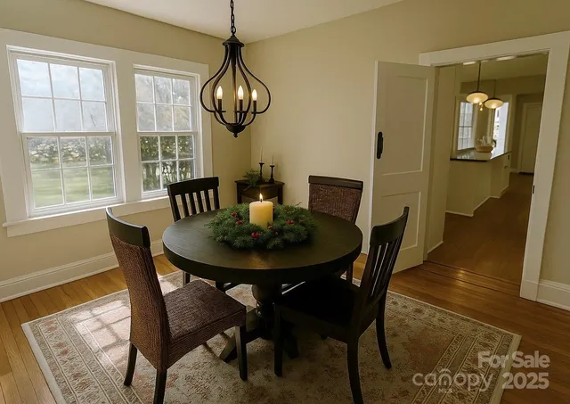 a view of a dining room with furniture window and wooden floor