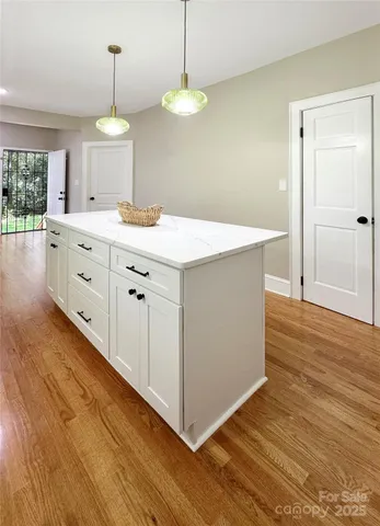 a spacious bathroom with double vanity and a sink