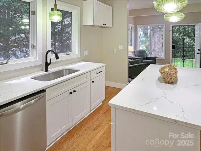 a kitchen with a sink and a window