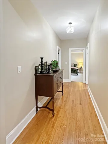 a view of a workspace with furniture and wooden floor