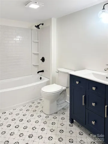 a bathroom with a toilet a sink and a bathtub