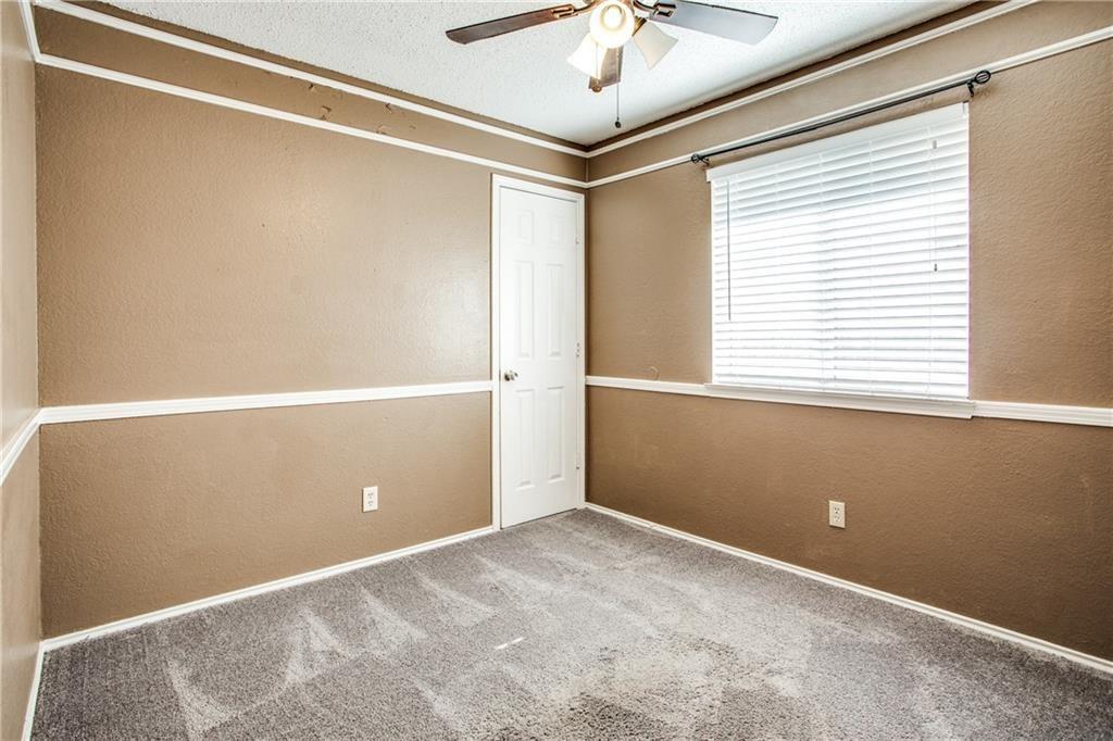 6817 Haltom Road Fort Worth, TX 76137 - Photo 9 of 25 Carpeted room featuring a ceiling fan with integrated lighting, a window with blinds, and a white paneled door