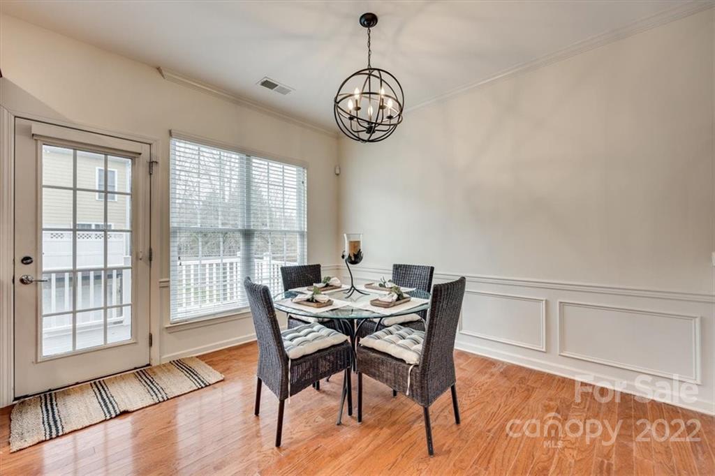 927 Lyndley Drive Fort Mill, SC 29708 - Photo 11 of 48 a view of a dining room with furniture window and wooden floor