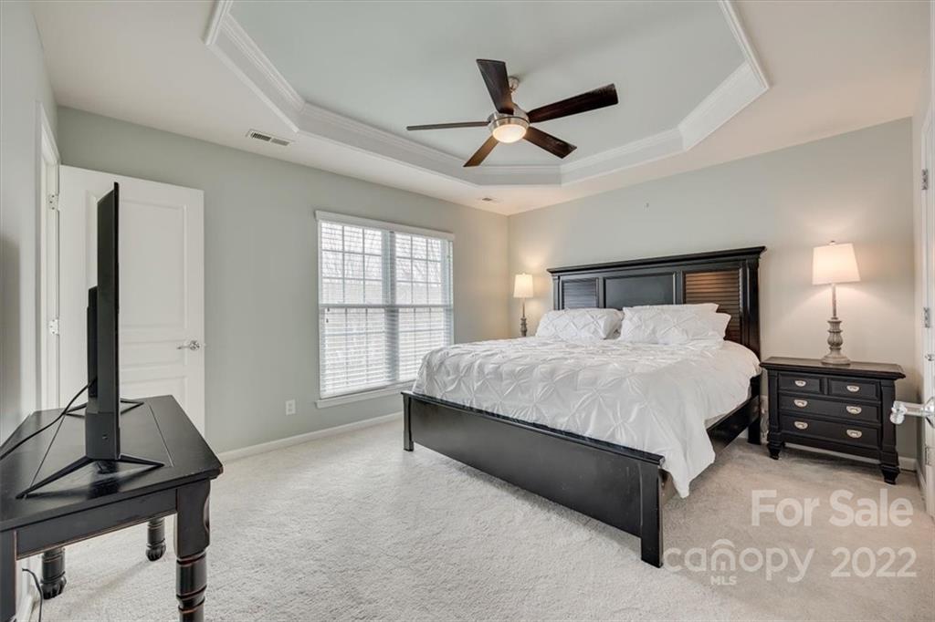 927 Lyndley Drive Fort Mill, SC 29708 - Photo 18 of 48 a bedroom with a bed and a window