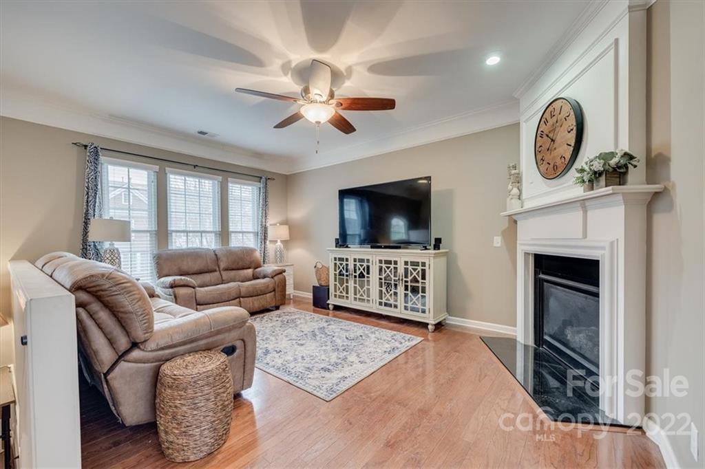 927 Lyndley Drive Fort Mill, SC 29708 - Photo 5 of 48 a living room with furniture a flat screen tv and a fireplace