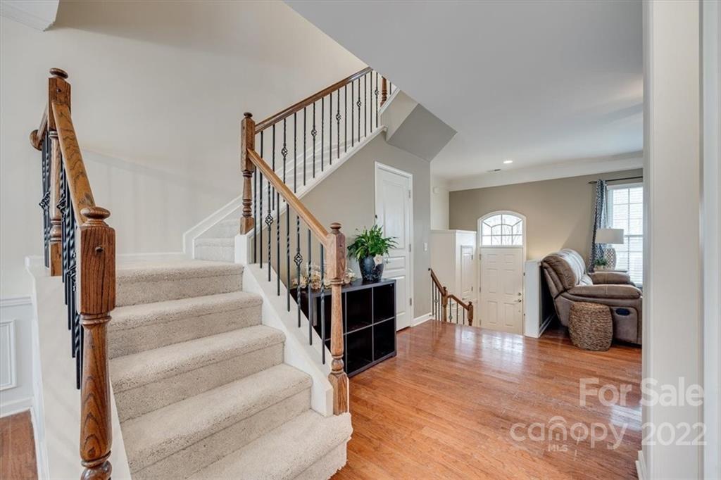 927 Lyndley Drive Fort Mill, SC 29708 - Photo 9 of 48 a view of entryway and hall with wooden floor