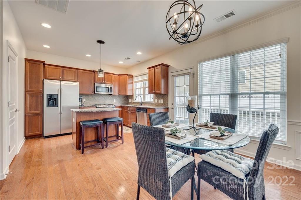 927 Lyndley Drive Fort Mill, SC 29708 - Photo 10 of 48 a view of a dining room with furniture window and wooden floor
