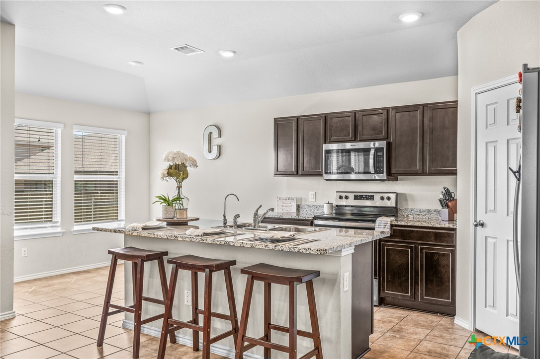 1006 Rosa Parks Drive Killeen, TX 76543 - Photo 1 of 34 a kitchen that has a sink and a stove in it